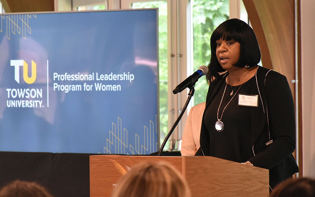 Black woman speaking to women's leadership cohort