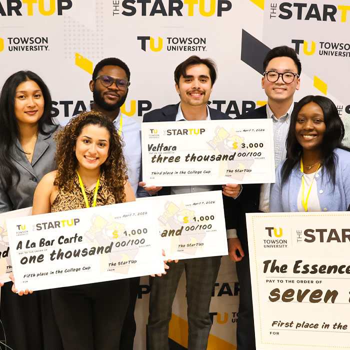 college cup finalists with large checks