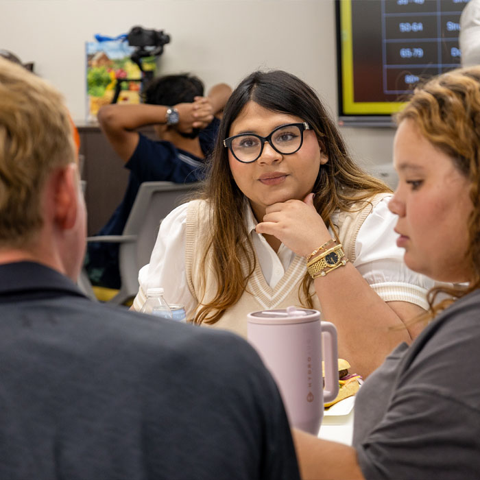 young high school girl engaged in conversation