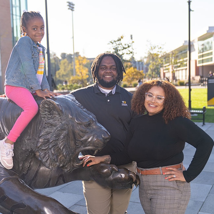 dajaha and her partner and daughter