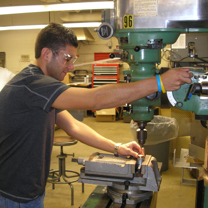 student in machine shop
