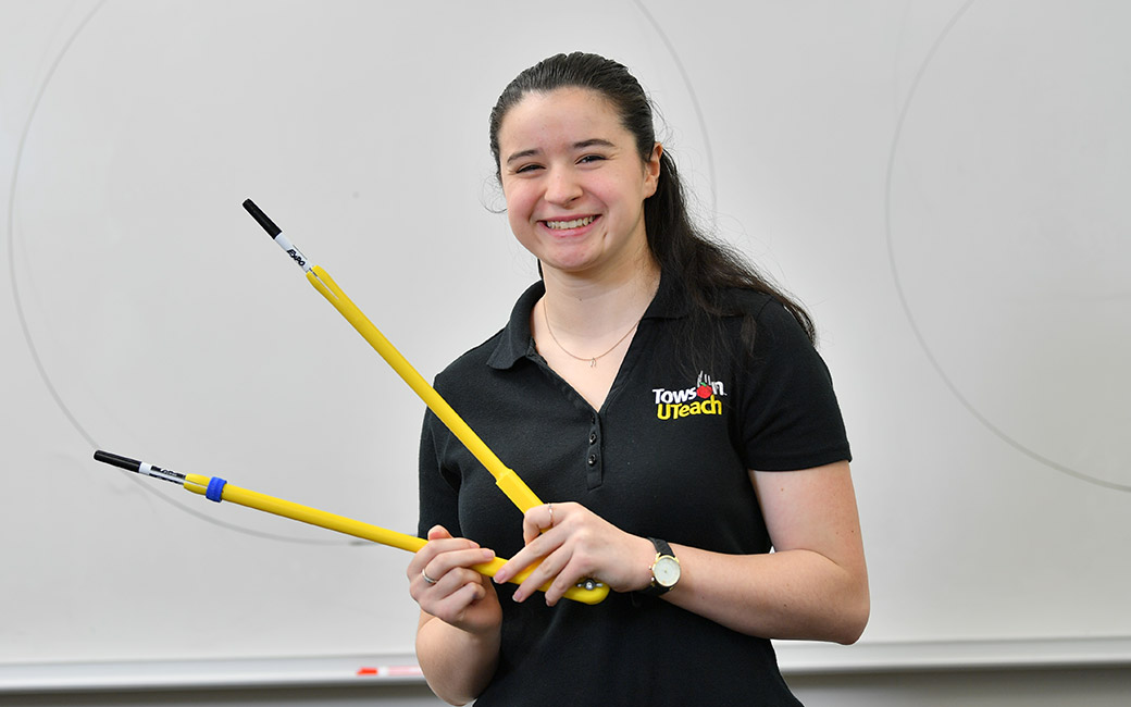 Rachael Talbert, pictured at the board with a giant compass she uses in math class.