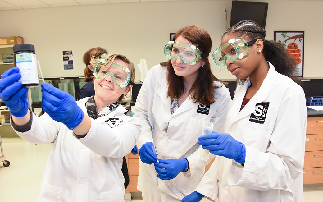 mary stapleton and sudents in lab