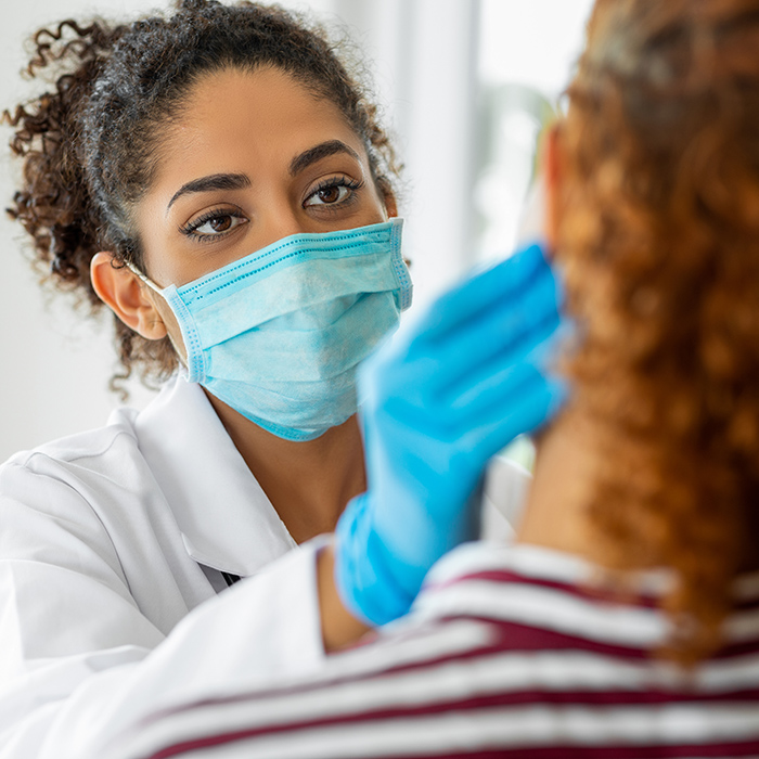 Physician doing a physical exams