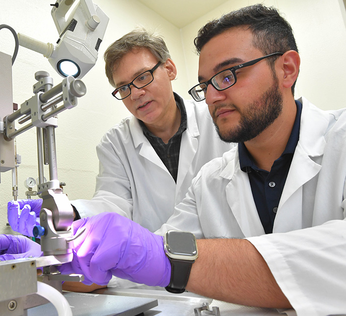 Psychology professor and student in lab