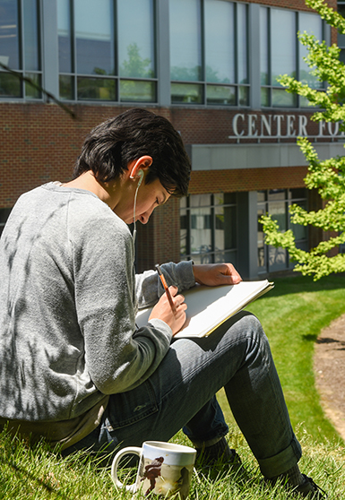student studying outside