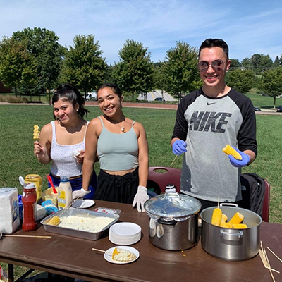 students on campus enjoying a cookout