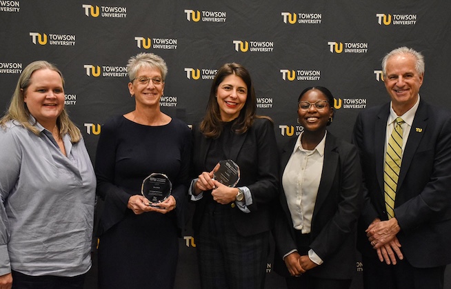 Towson University lead for MentHER, Lauren Tigue-Meredith (center) receives the award alongside her community partners and Dr. Mark Ginsberg. 