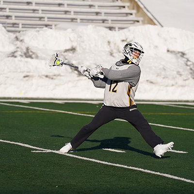 TU student athlete playing lacrosse
