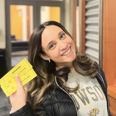 TU student shows off tickets to an arts event