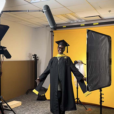 TU student in Commencement robe