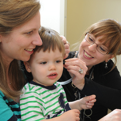 audiology student with parent and child