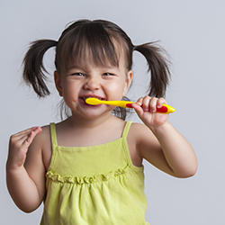 Image of girl brushing teeth