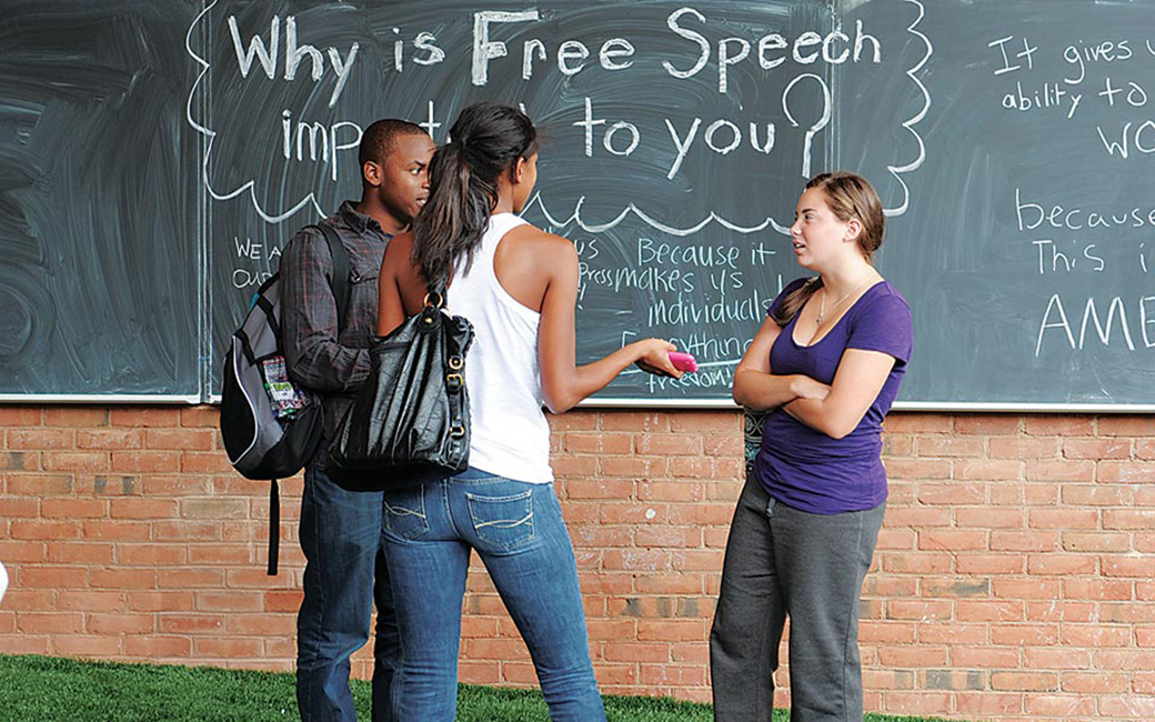 students talking in front of freedom square