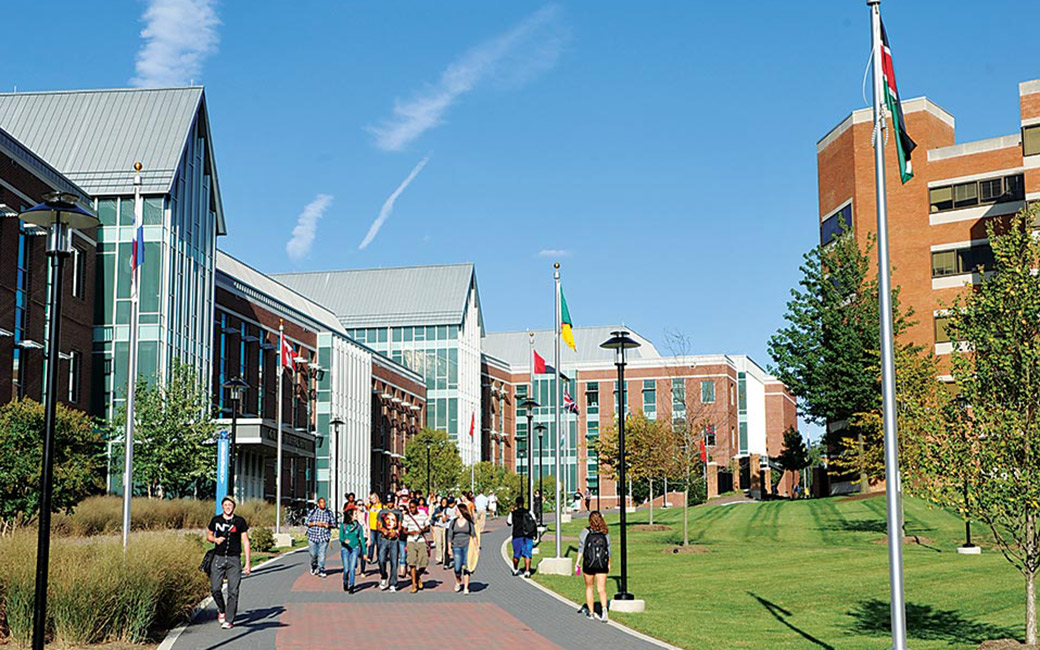 Students walking outside by the Liberal Arts and Psychology buildings