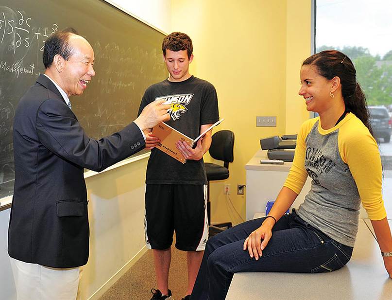 professor and two students in a classroom