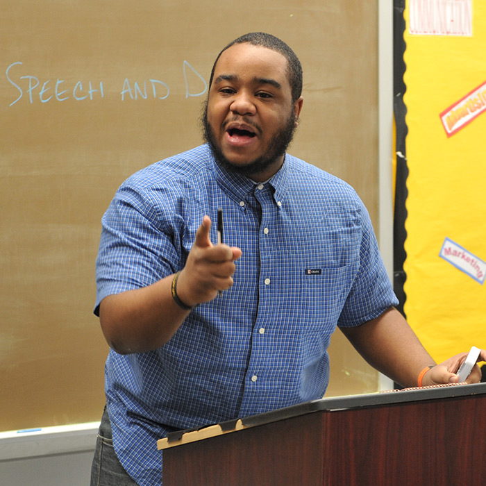 Student participating in a classroom debate
