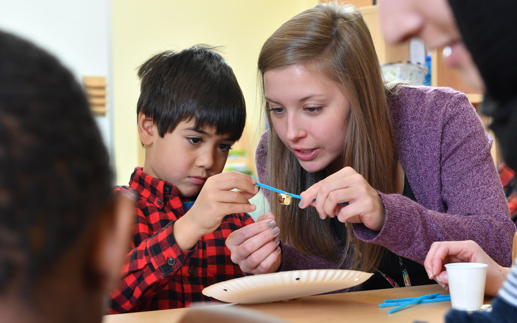 student and child painting