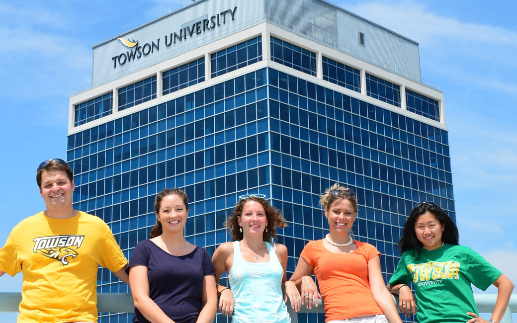 Students posing in front of the Institute for Well-Being