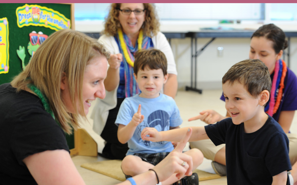 Speech language pathology student with a young child