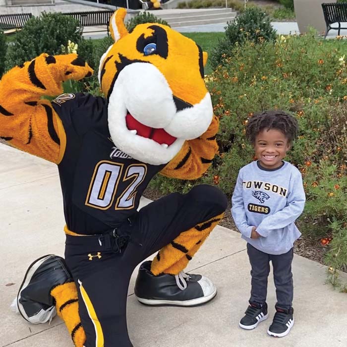 Doc the Tiger with a small child