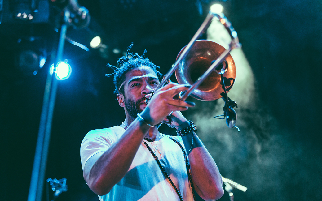 Darius Christian playing the trombone