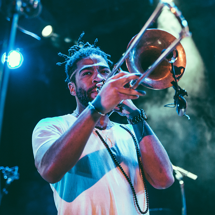 Darius Christian playing the trombone