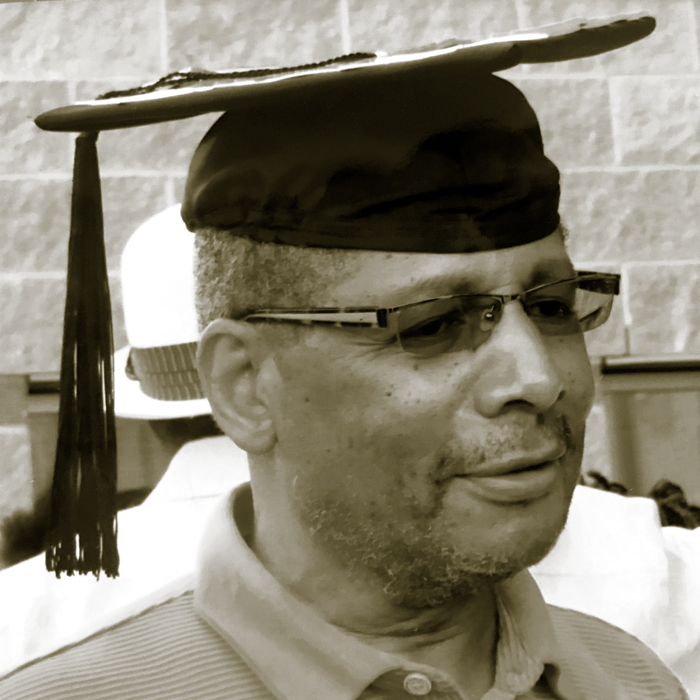 Leslie Isler II wearing his daughter's graduation hat