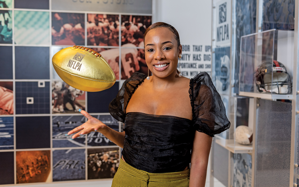 Leslie Isler tossing a gold football