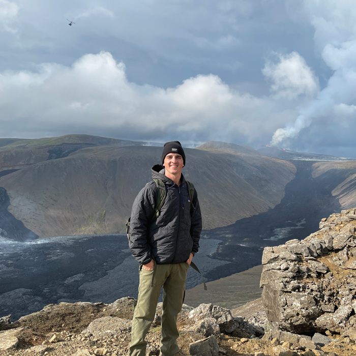 Mike Thorpe, standing in front of a volcano in Iceland