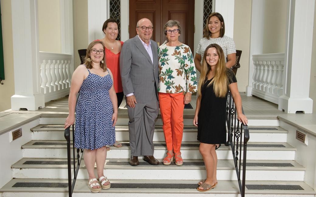 Donors Alena and David M. Schwaber with students in front of  the Auburn House