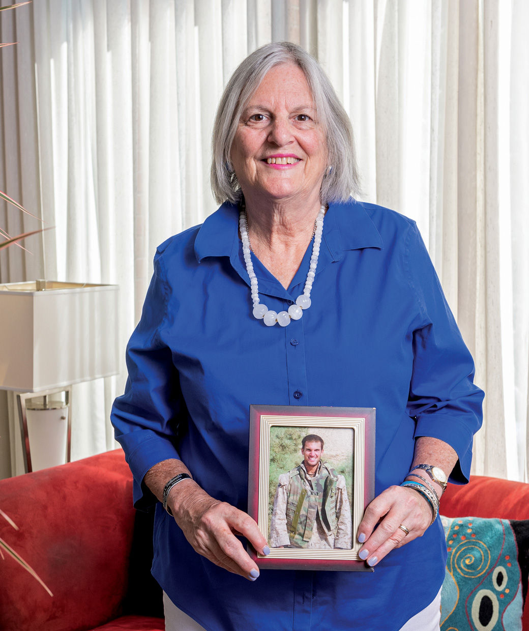 Tracy Miller holding a picture of her son