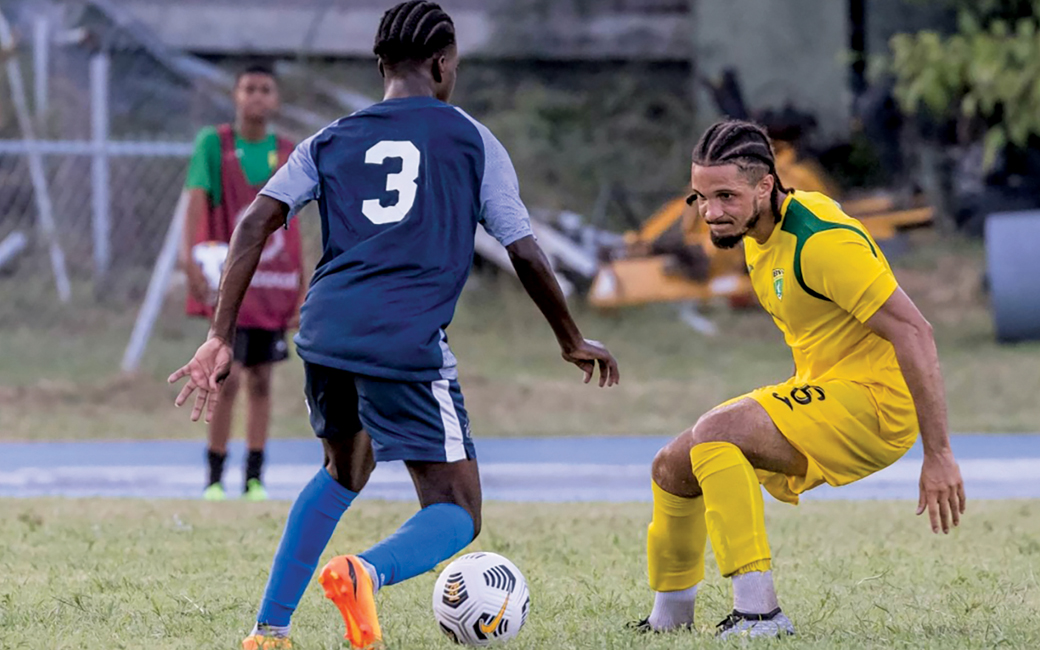 Two people playing soccer