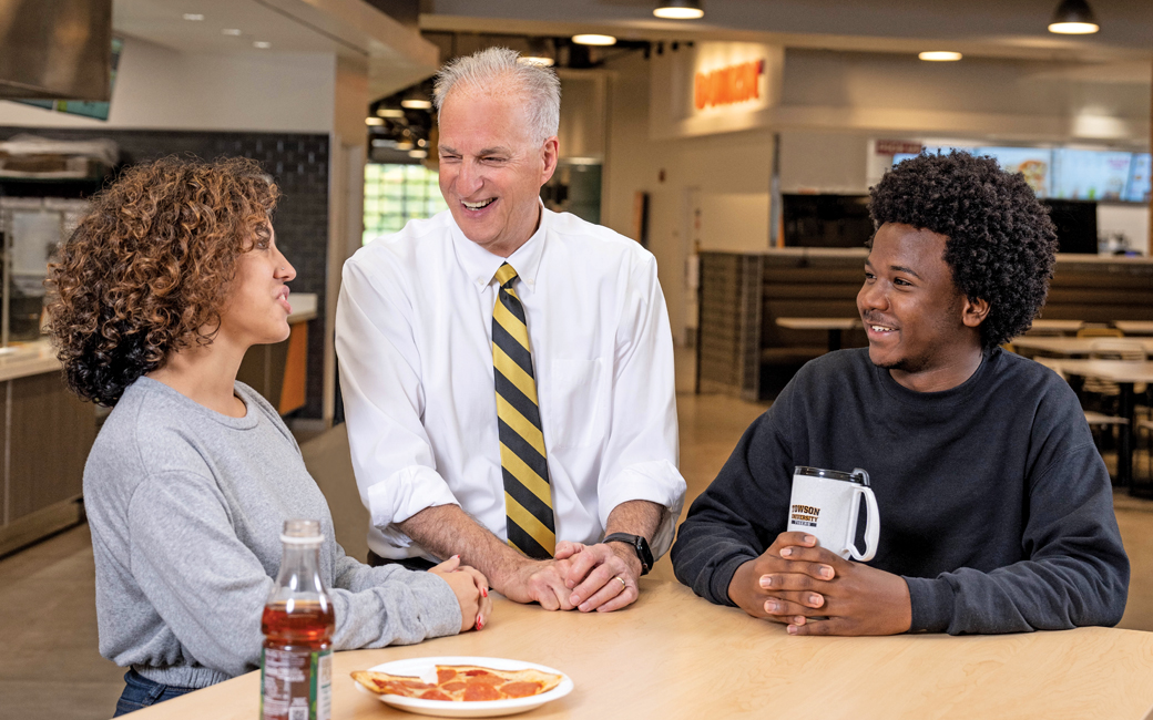 Mark Ginsberg talks with students over coffee