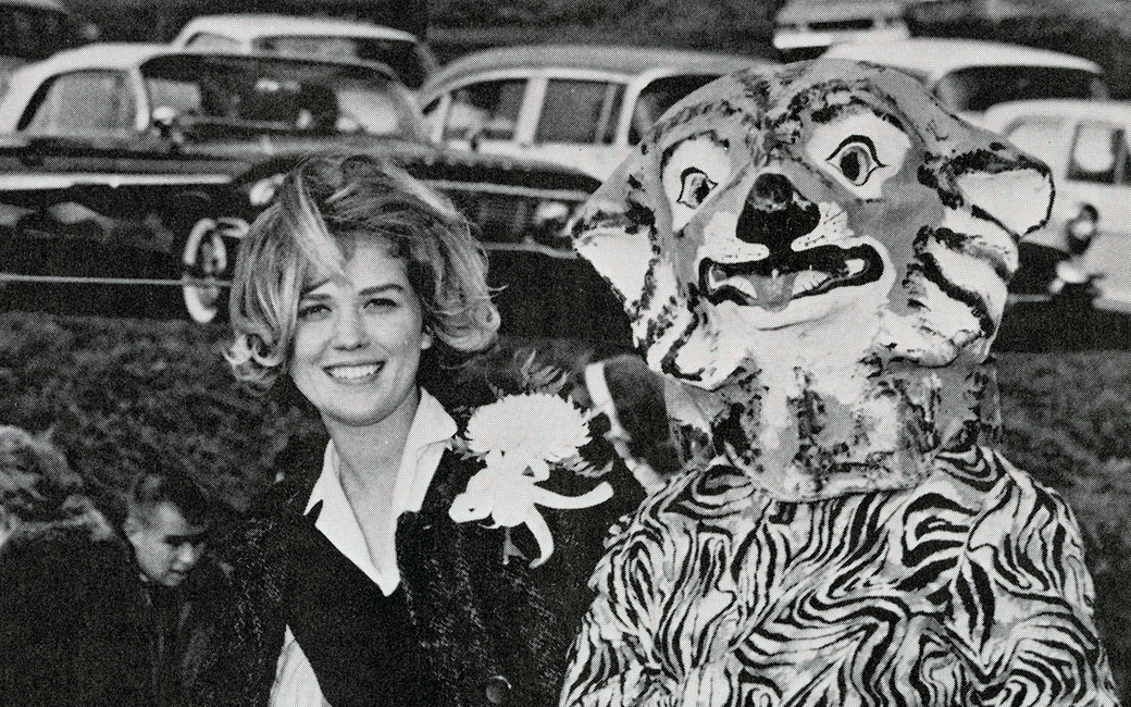 Black and white photo of a student with an early iteration of Doc the Tiger