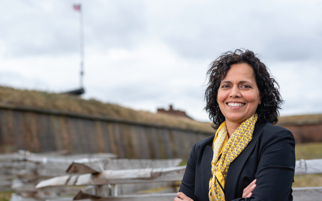 Arundhati Rao standing in front of Fort McHenry