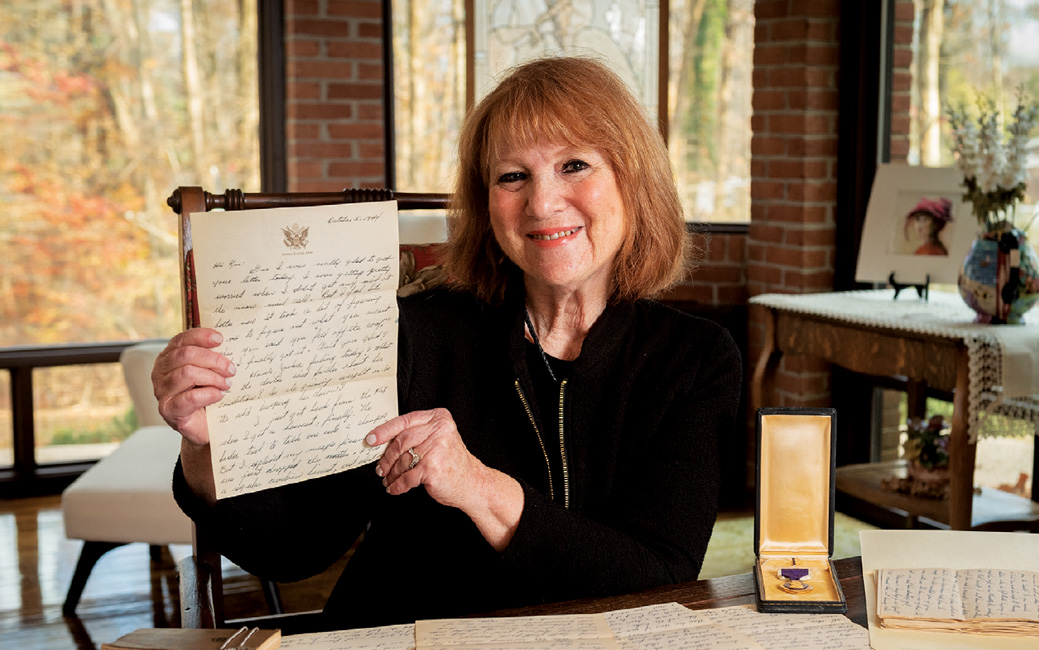 Jackie Cohen holding up a letter