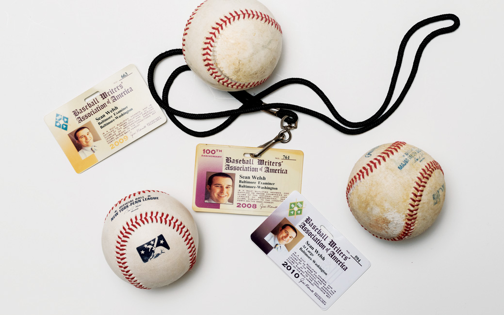 Sean Welsh's press passes and baseballs