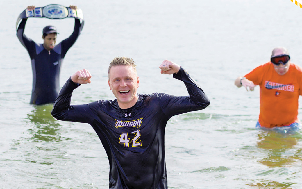 smiling Steve Eigenbrot flexing during the Polar Bear Plunge