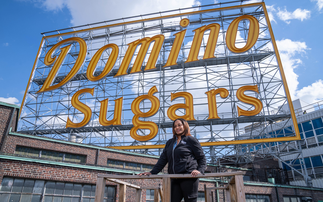 T'Shurah Dove in front of the Domino Sugar sign