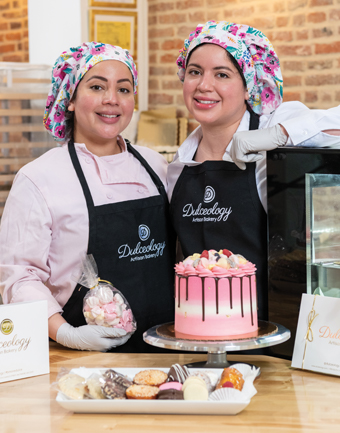 Alejandra '15 (right) and Nicole Leiva inside their Baltimore bakery