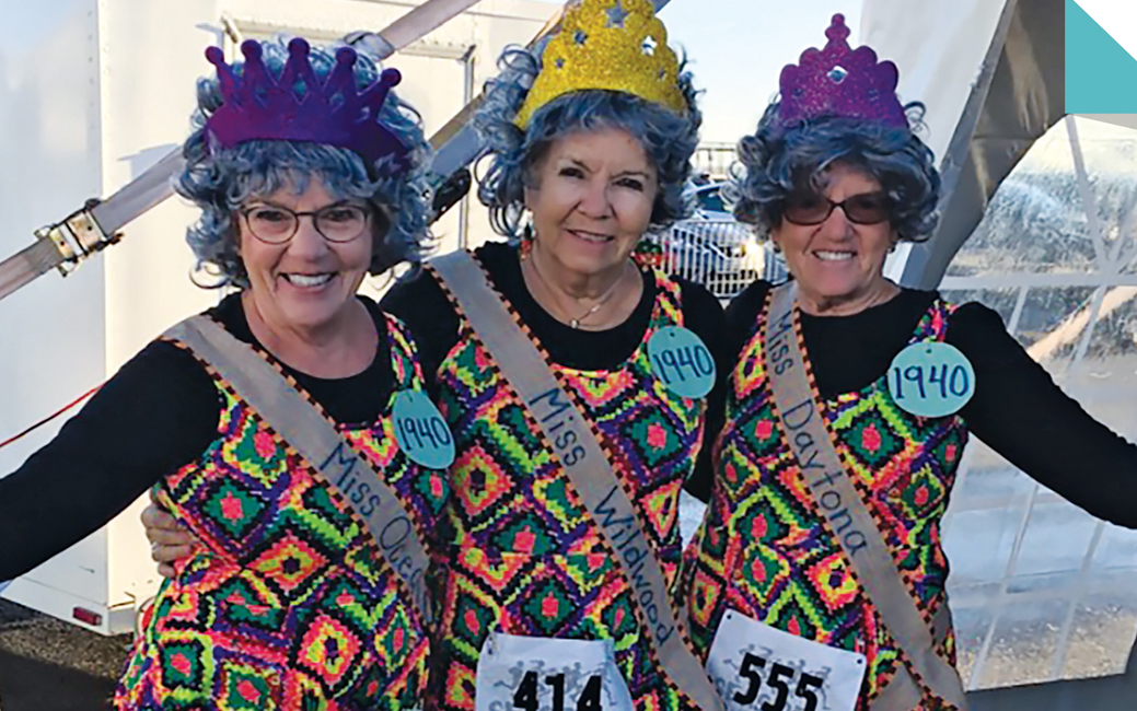 3 ladies in costumes at a running event