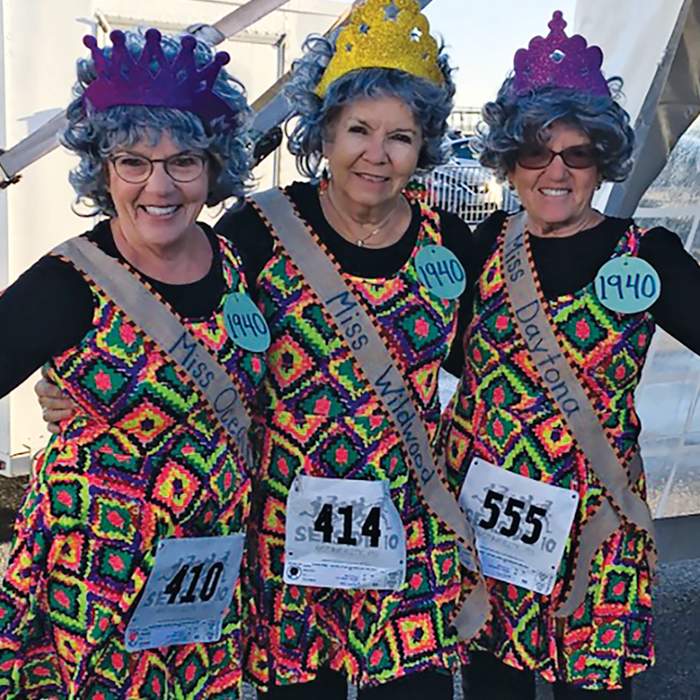 Jayne Asher Astle ’62, Phyllis Balzer Beardmore ’62 and Joann Asher Scott ’62wearing running bibs