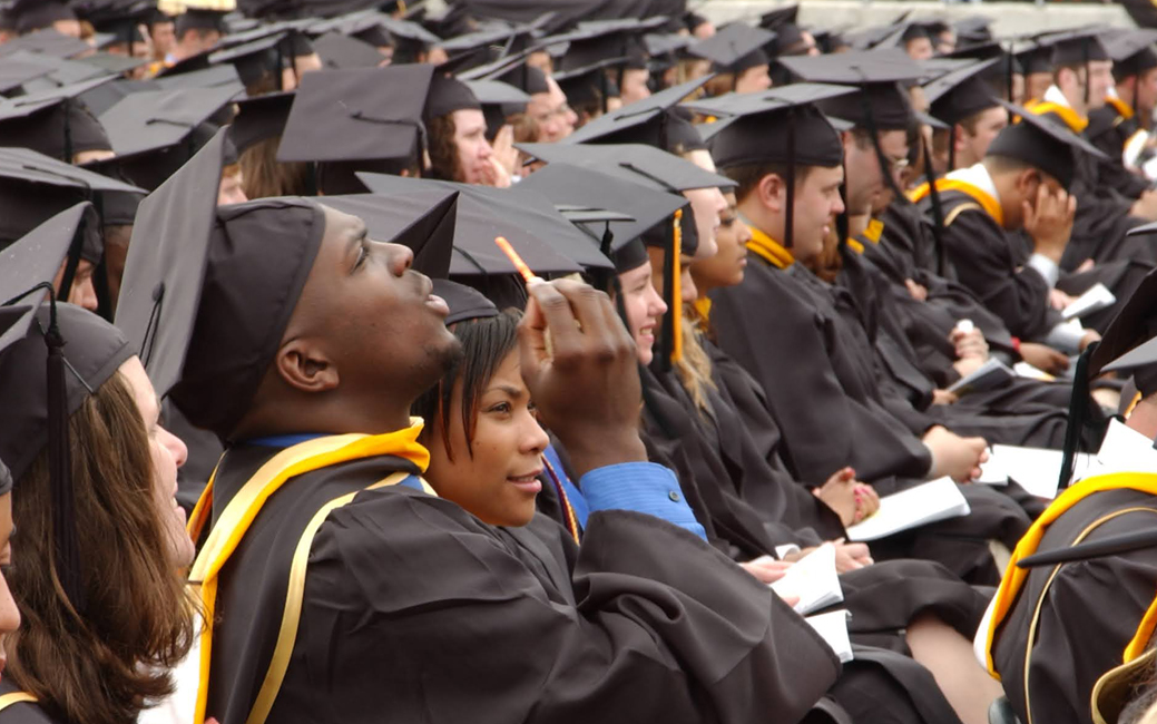 Close up of graduates seated