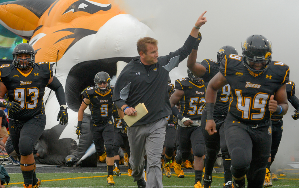 Rob Ambrose and Towson running out on the field 