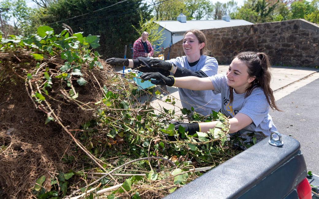 Students picking up brush during the Big Event