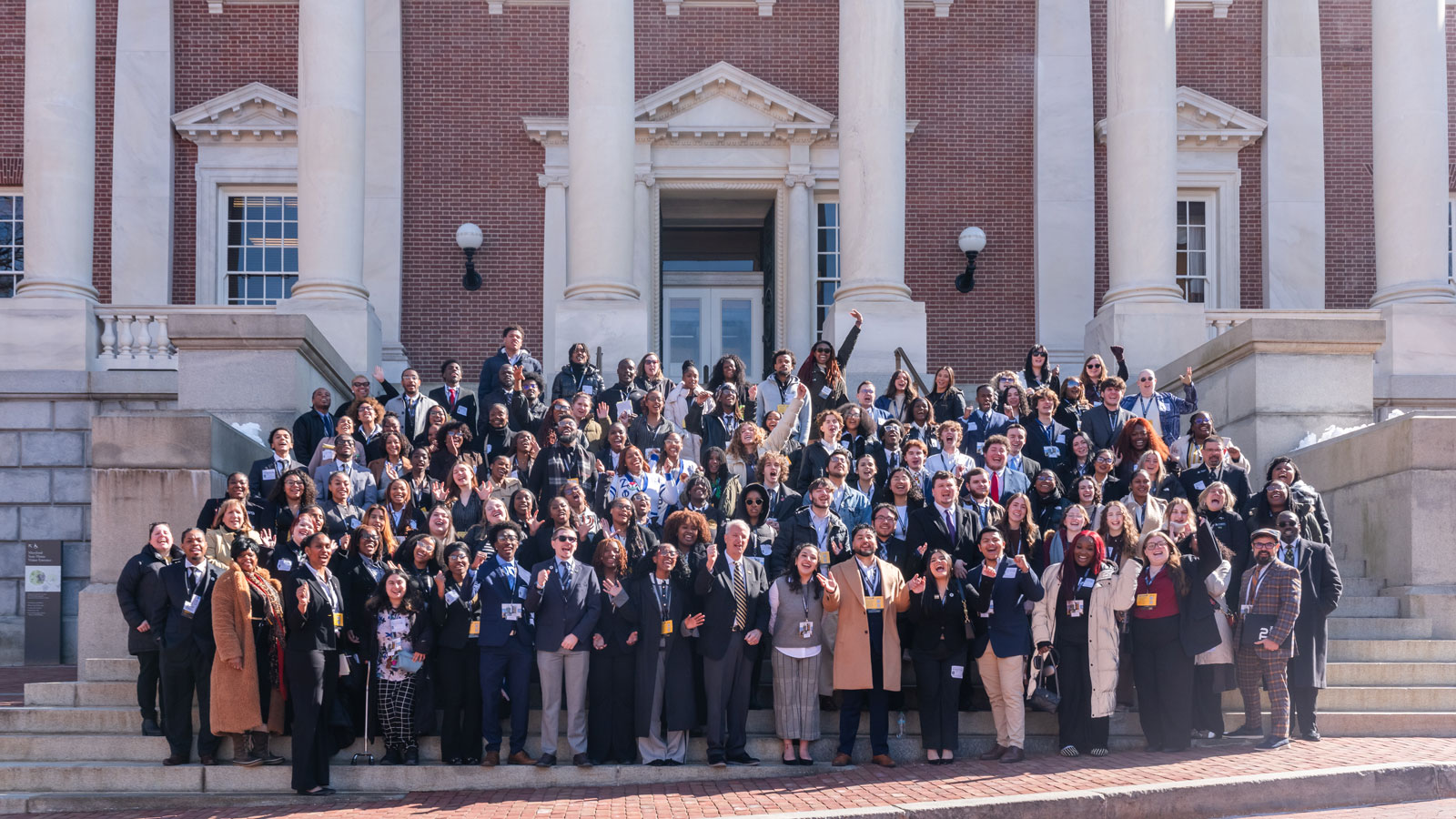 Towson University Faculty and Staff pose for a photo in front of the Maryland State Capitol Building 