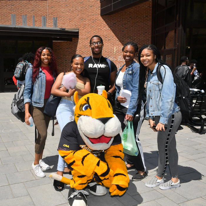 Doc mascot with students