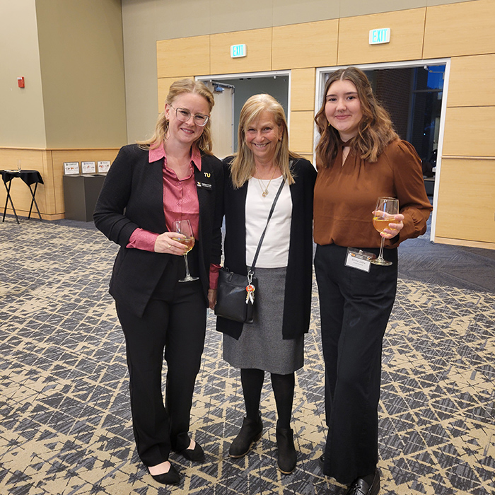 Three people standing