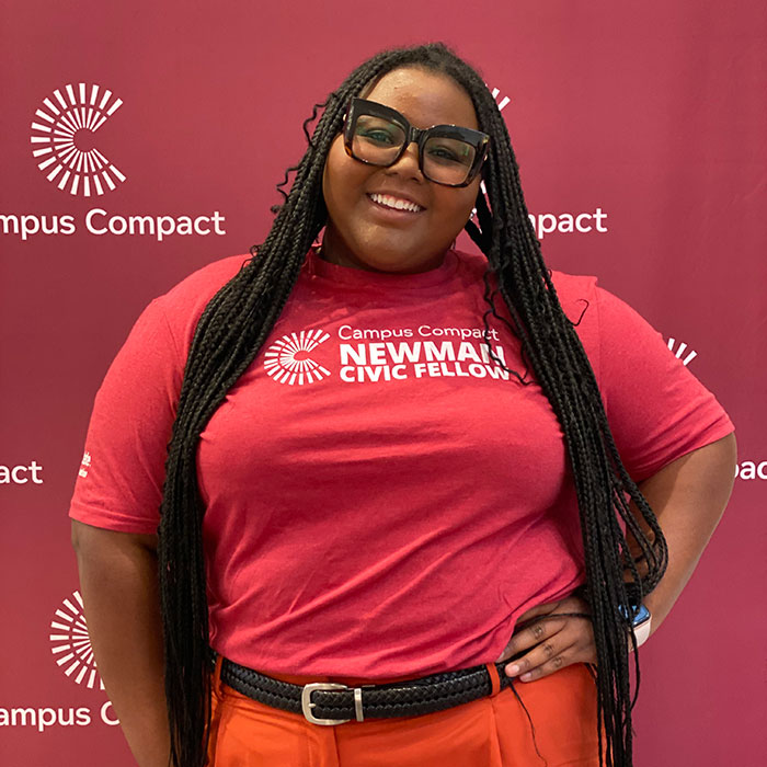 photo of ajalon mercer with campus compact t-shirt